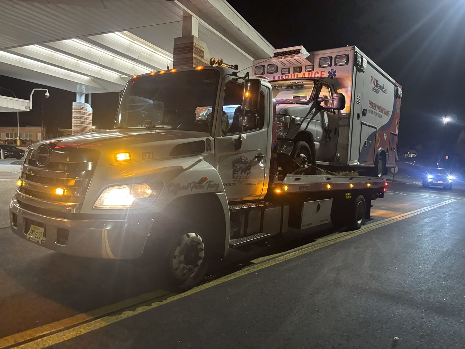 Ariel's 24 hour towing responding at night with emergency lights in NJ
